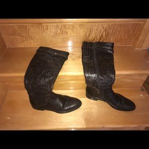 High cowboy print leather boots.